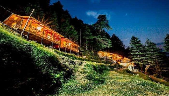 Cozy mountain cabin surrounded by autumn forests in Dalhousie, Himachal Pradesh.