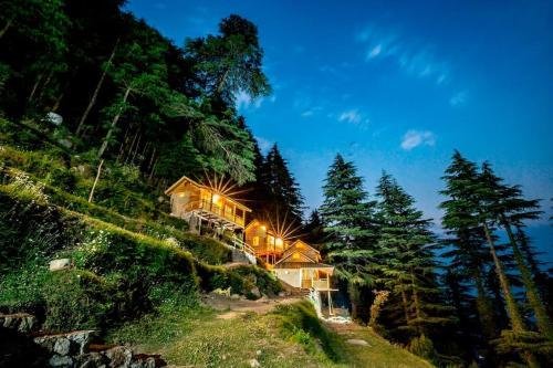 Cozy private mountain cabin surrounded by pine forests in Dalhousie after a scenic road trip.