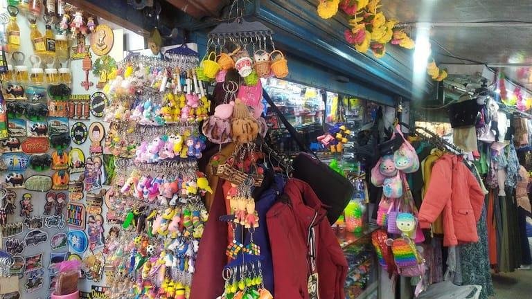 Visitors exploring handicraft and souvenir shops at Gandhi Chowk in Dalhousie