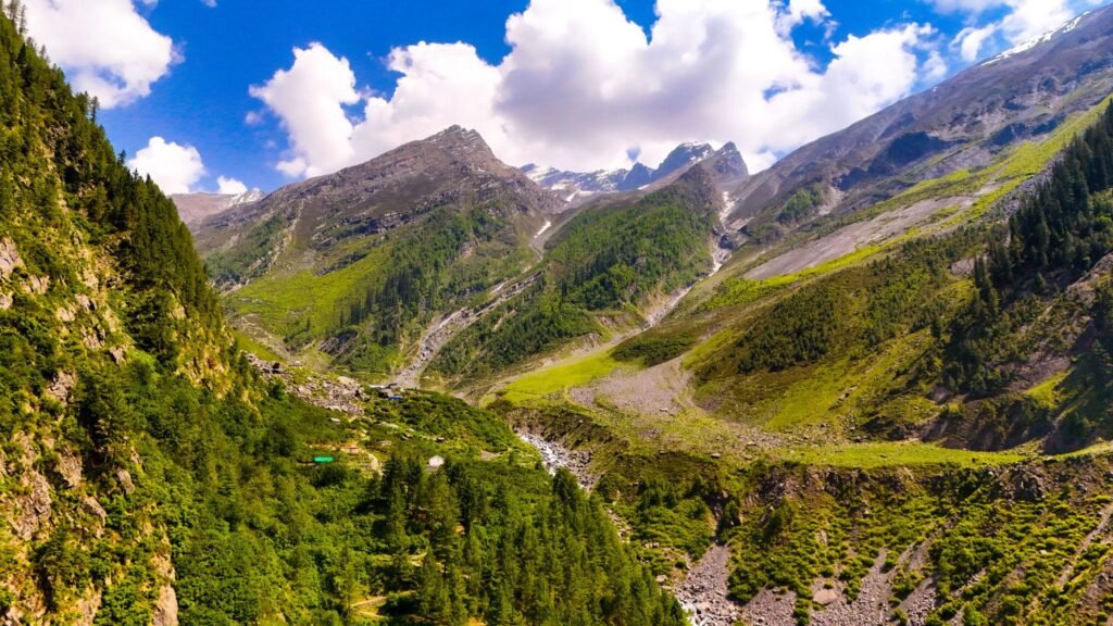 Trekkers on the Manimahesh Trek with the majestic Manimahesh Kailash peak in Chamba district