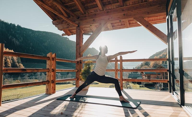Morning yoga routine during a yoga retreat in Himachal Pradesh overlooking the Himalayan mountains